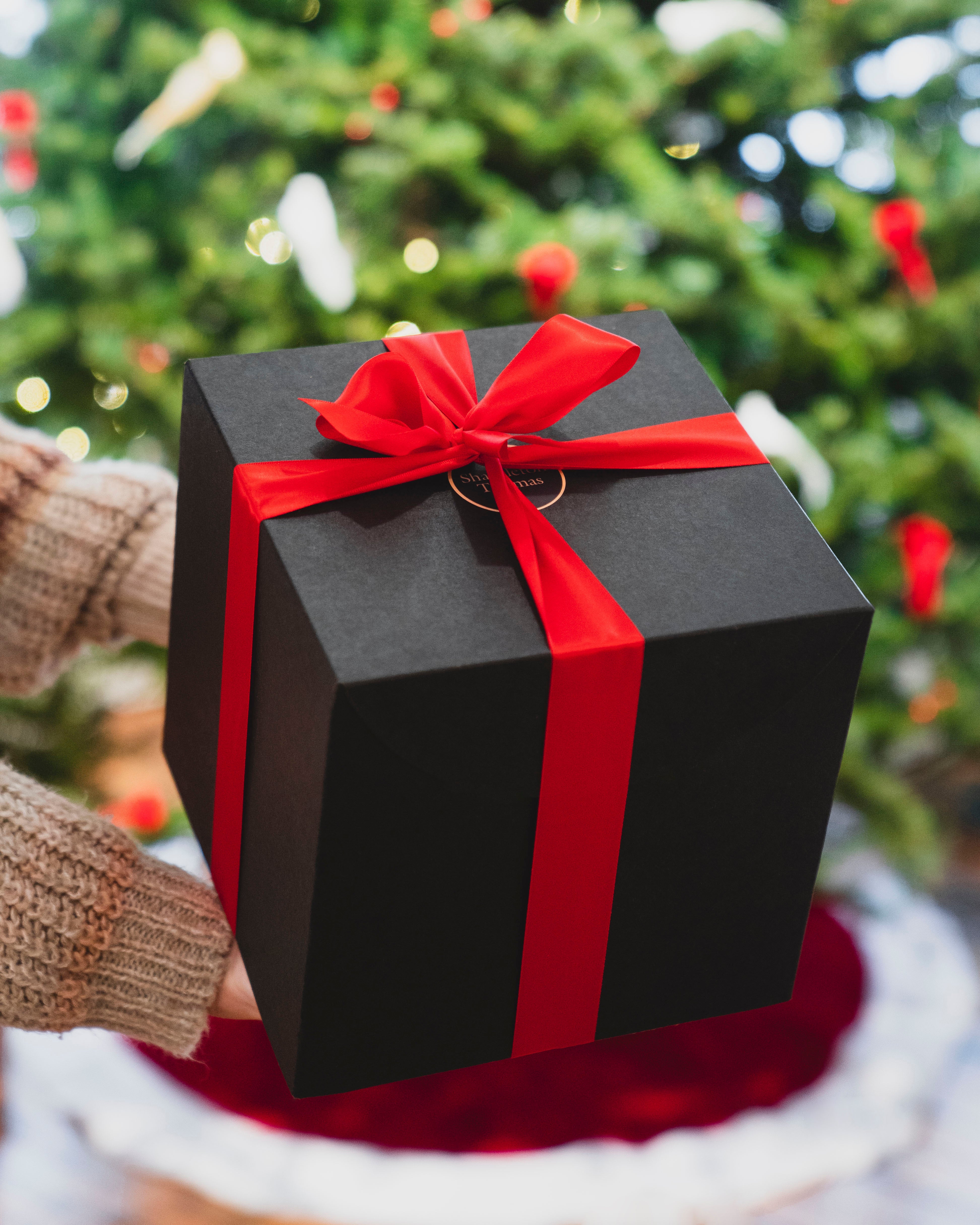 elegant-black-box-with-red-ribbon-holiday-gift-wrapping-for-gift-guide