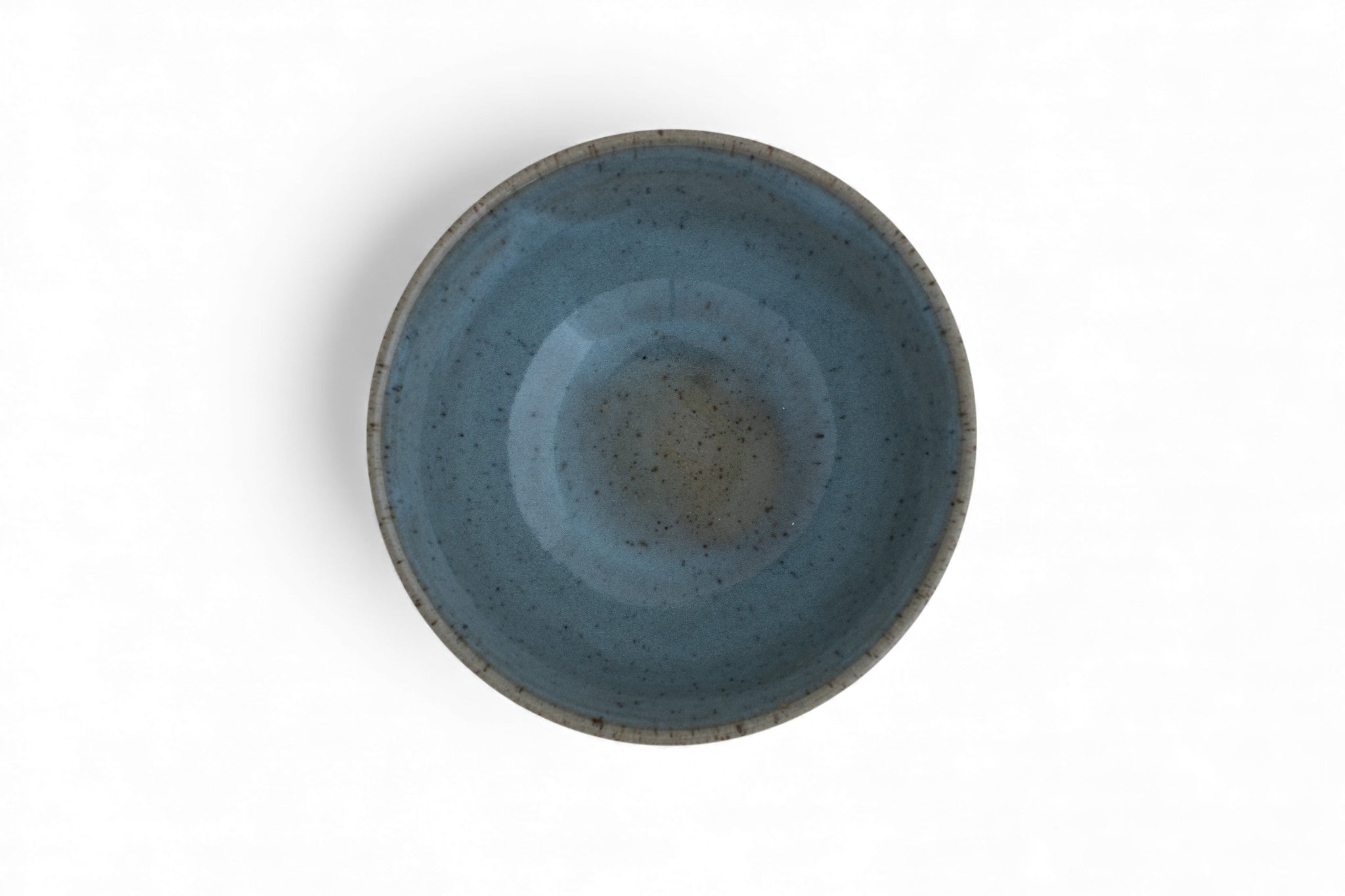 Handmade stoneware cereal bowl with raw clay and celadon glaze