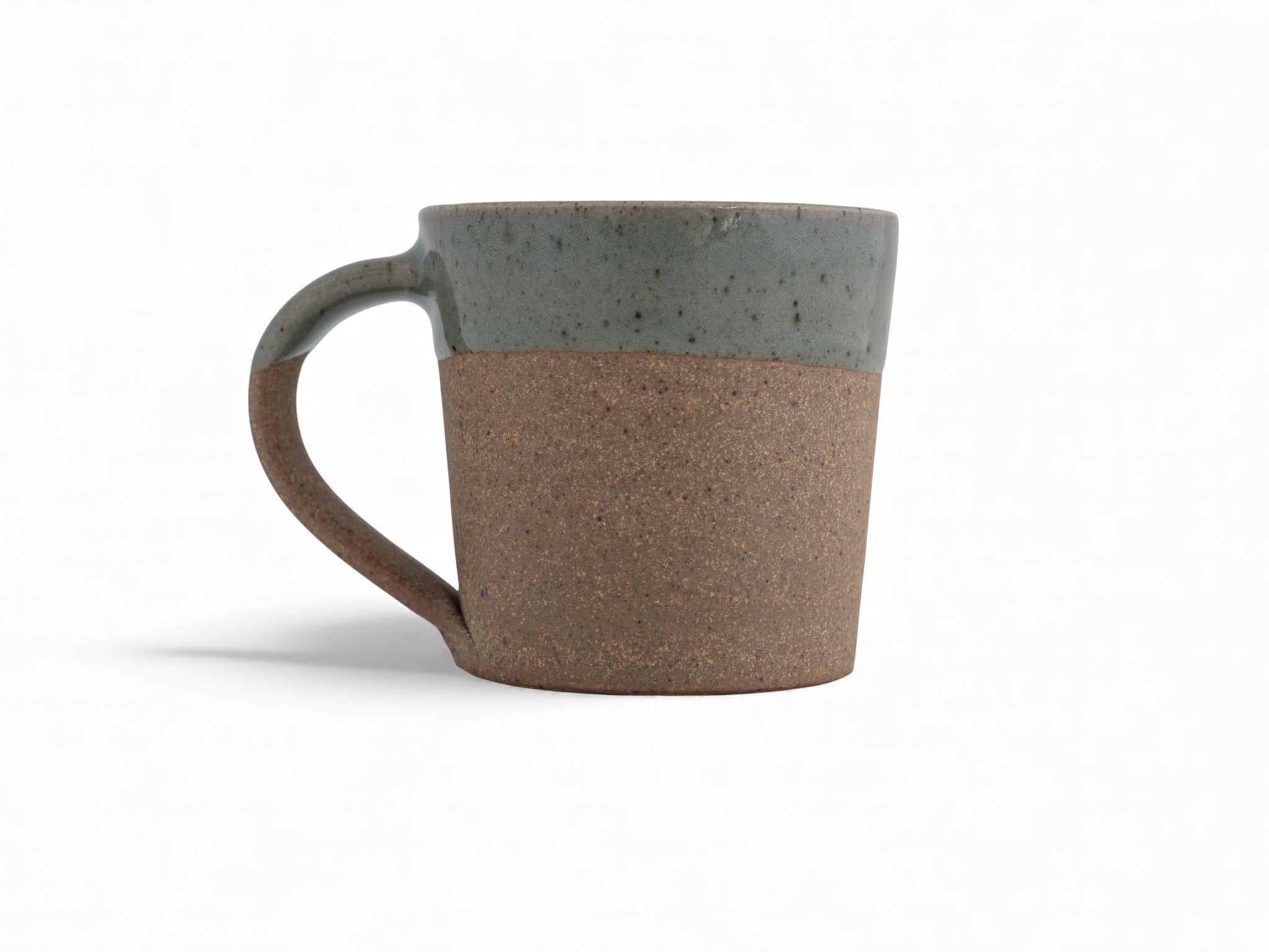 10 oz. handmade raw stoneware coffee mug dipped in celadon glaze