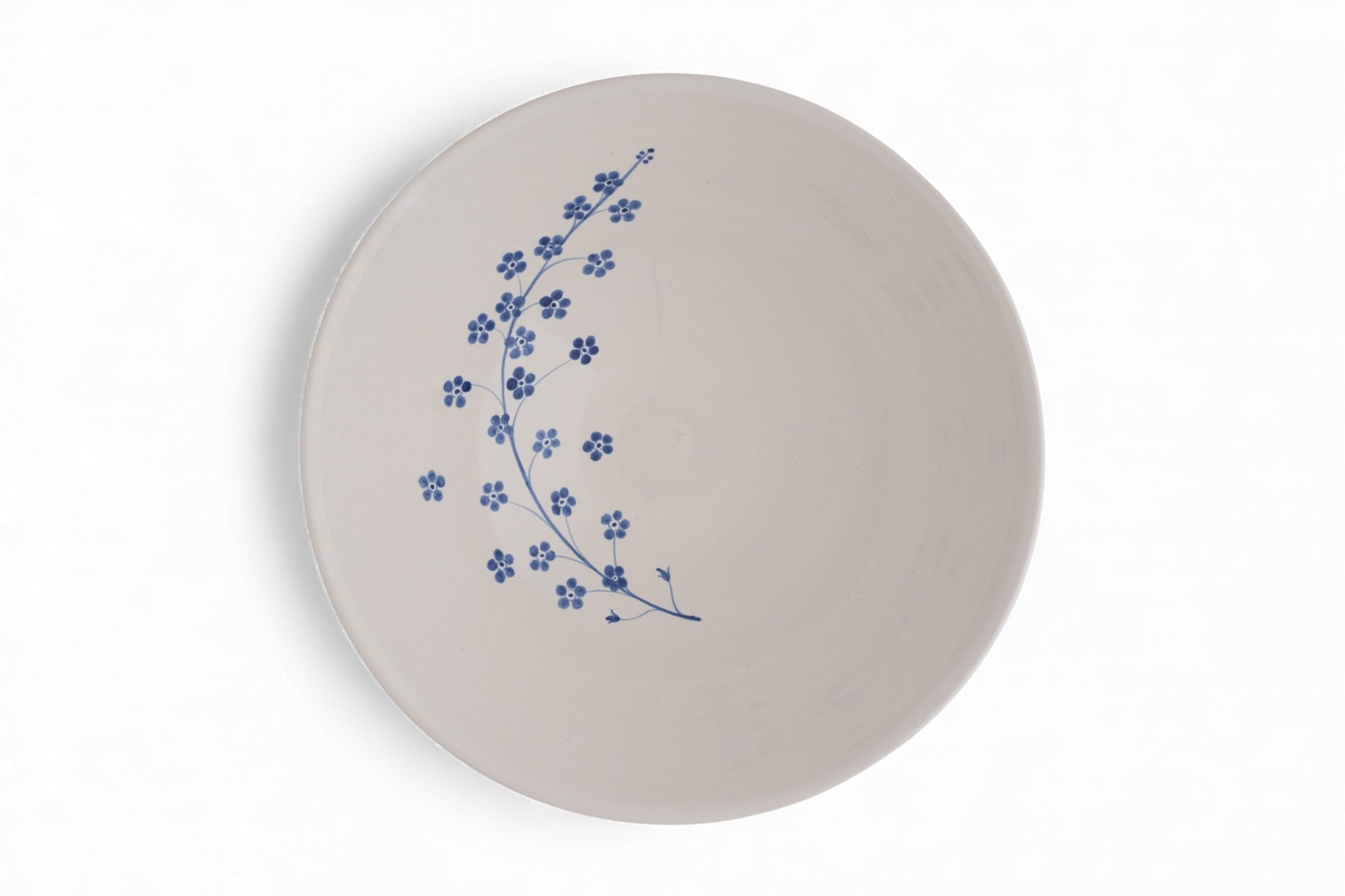 Handmade stoneware salad bowl with hand painted forget-me-not flowers