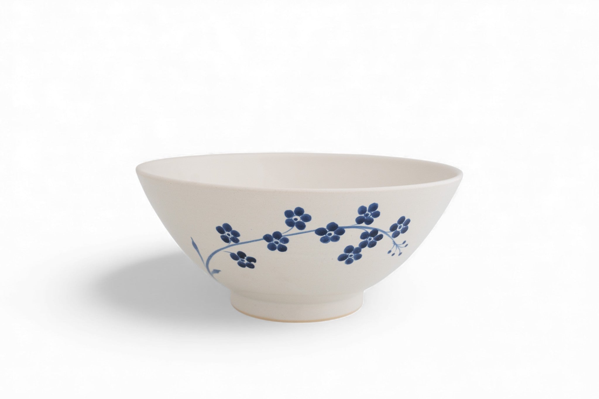 Handmade stoneware serving bowl with hand painted forget-me-not flowers
