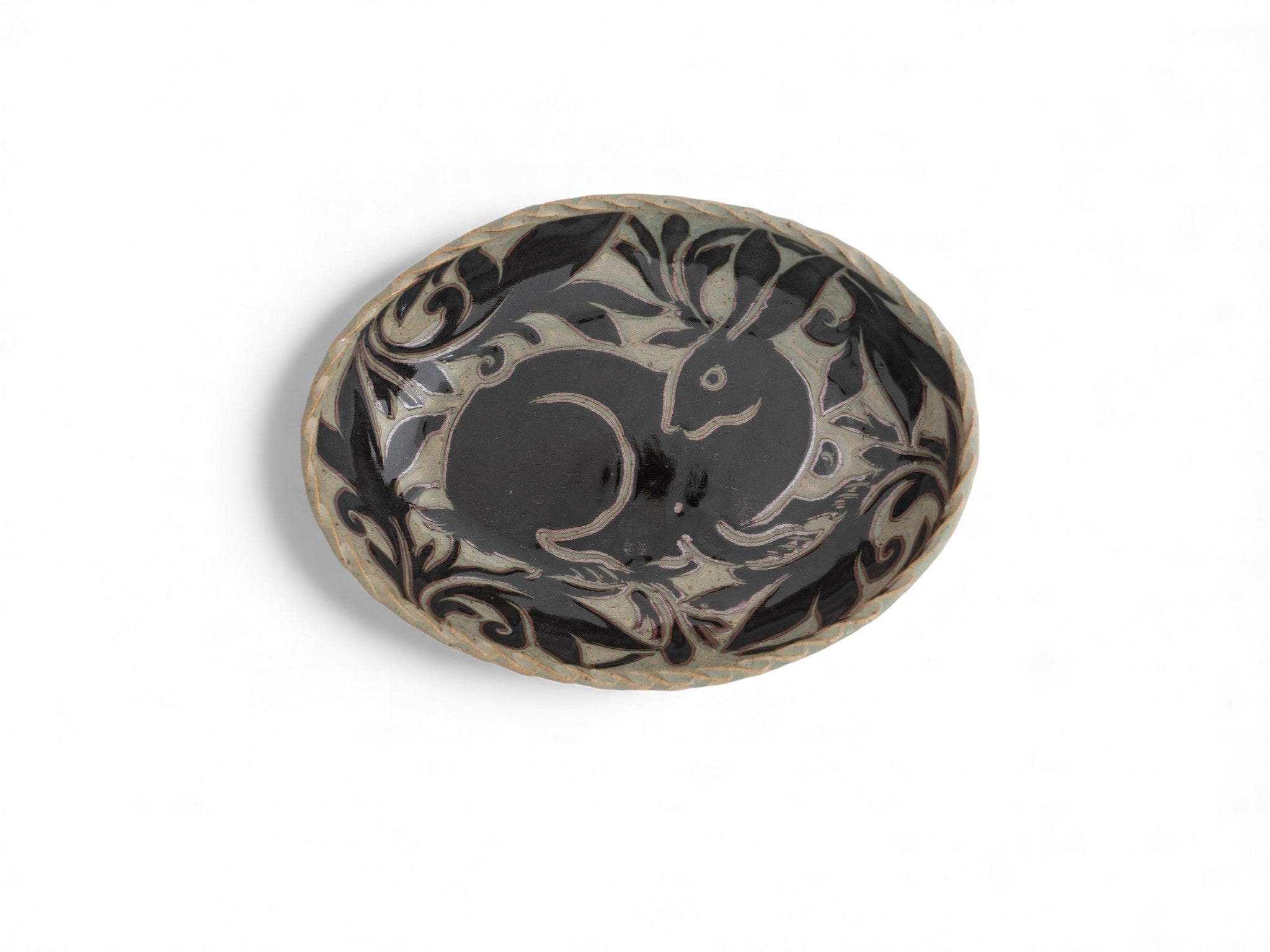 Handmade stoneware oval black carved platters with rabbit pattern