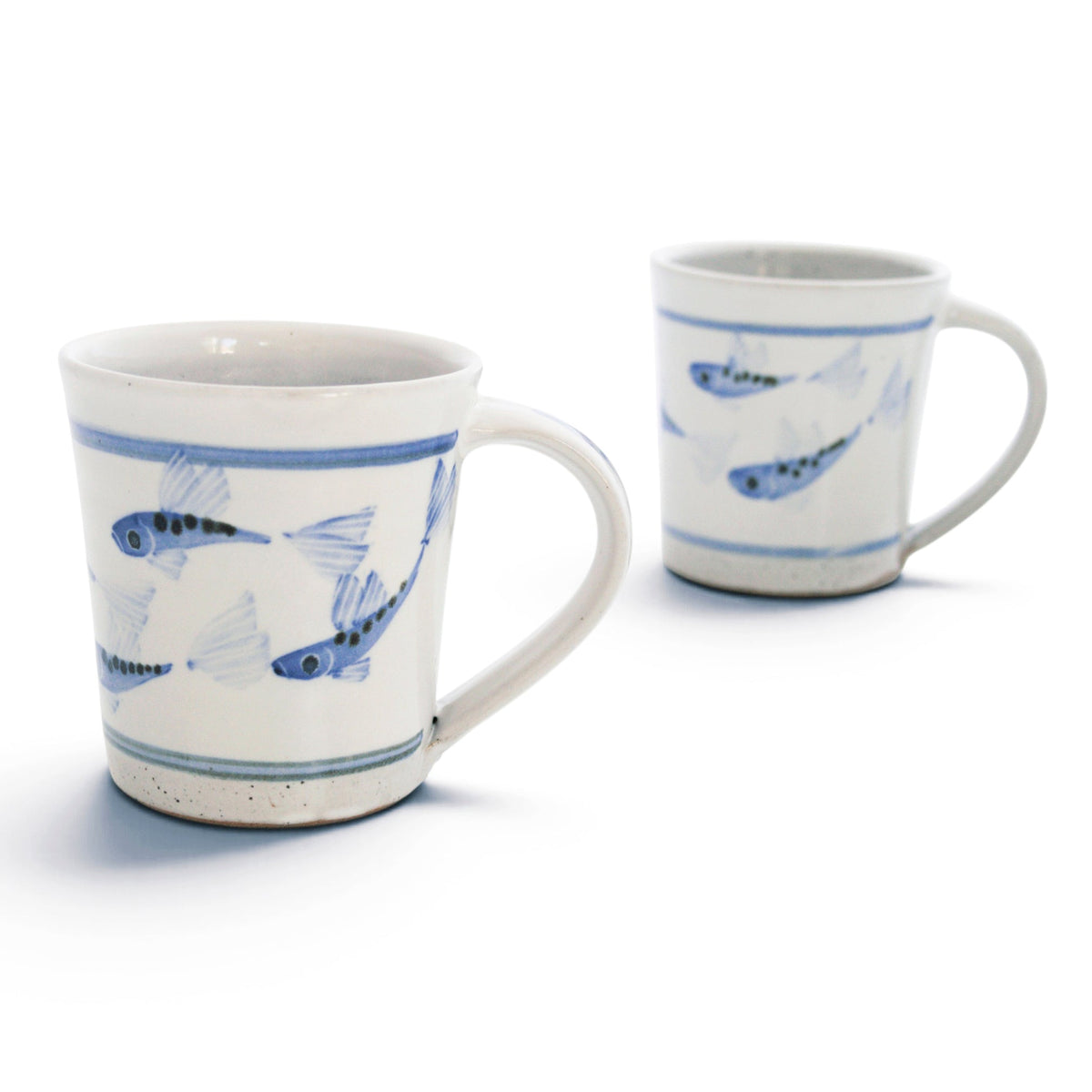 Two white ceramic mugs with blue fish illustrations and blue stripe accents, shown on a clean white background.