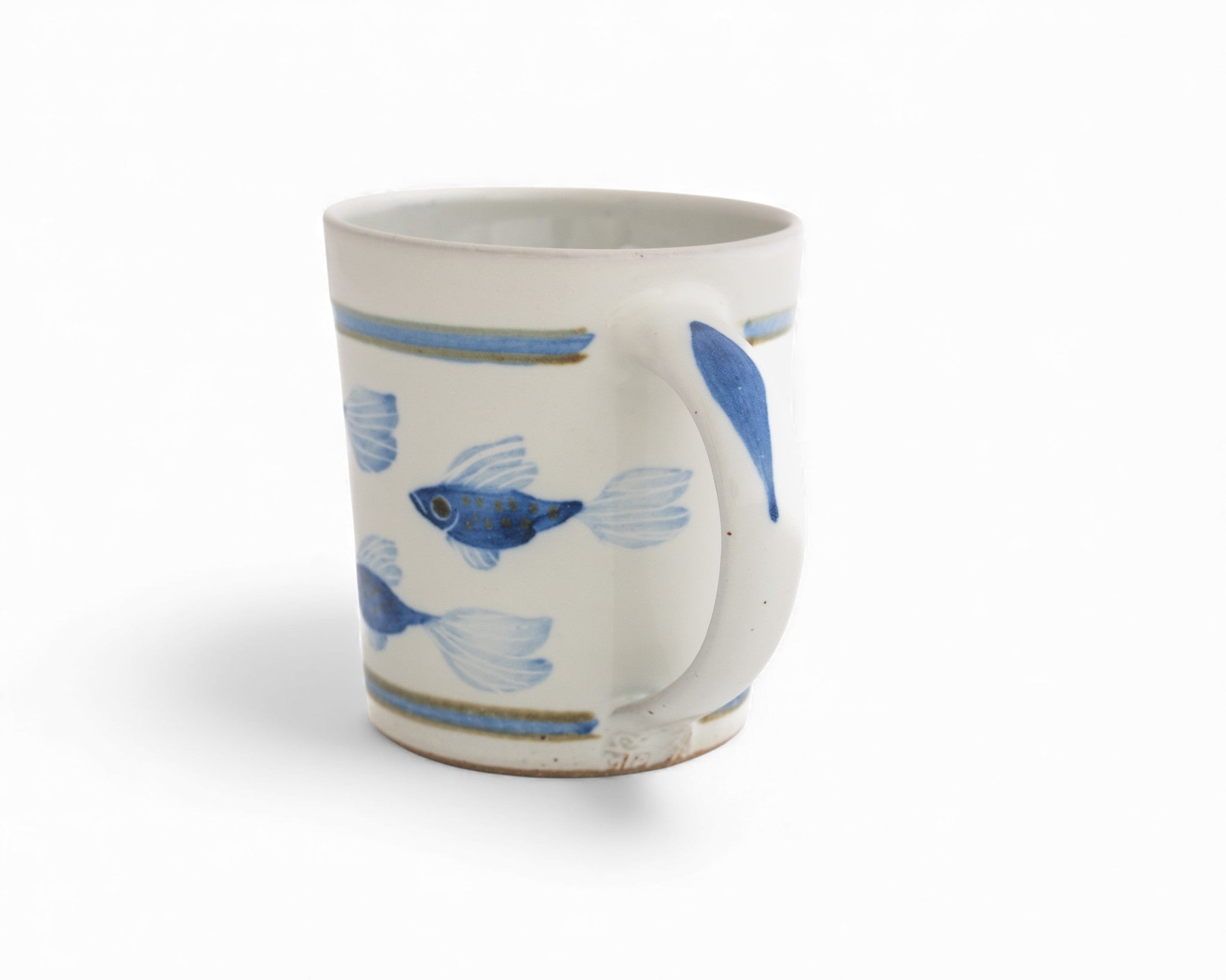 white handmade stoneware mug hand painted with cobalt blue fish