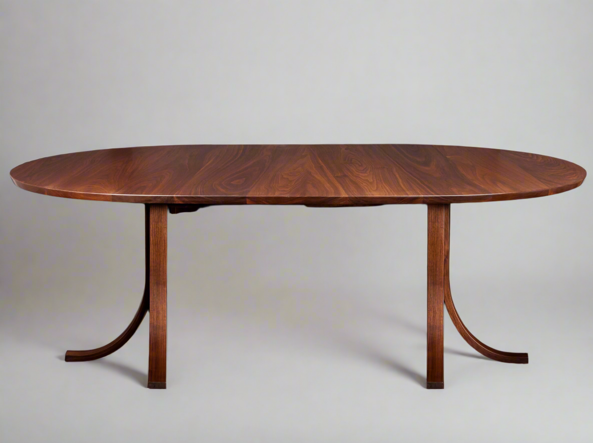 Vermont Handmade Round Extending Eagle Table in walnut, round with sleek and curved design