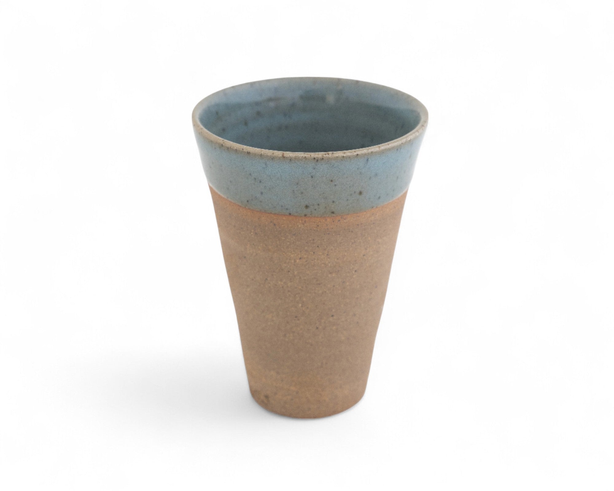 A medium-sized ceramic Devonshire beaker with a raw clay surface and interior glazed in shades of deep celadon green.