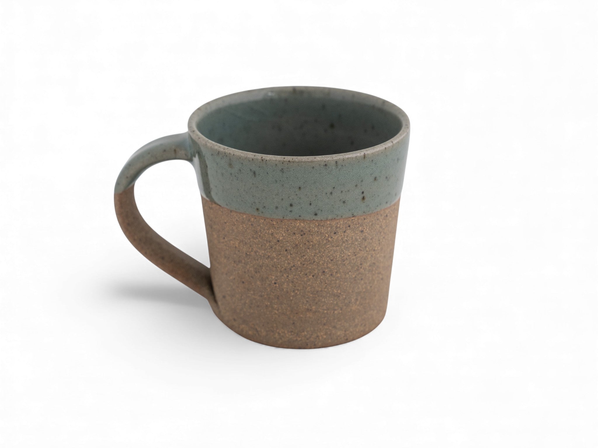 10 oz. handmade raw stoneware coffee mug dipped in celadon glaze