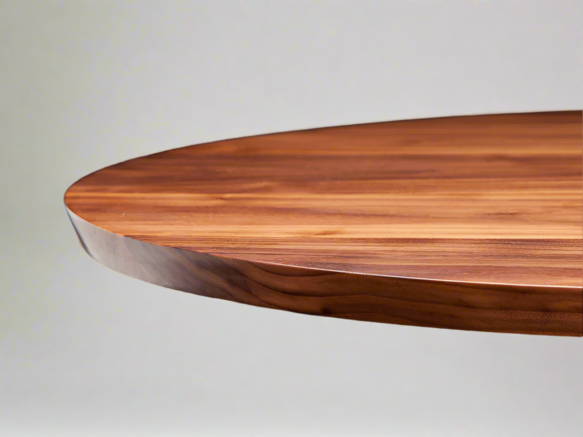 Handmade Round Eagle Dining Table in Walnut, with a modern sleek design 