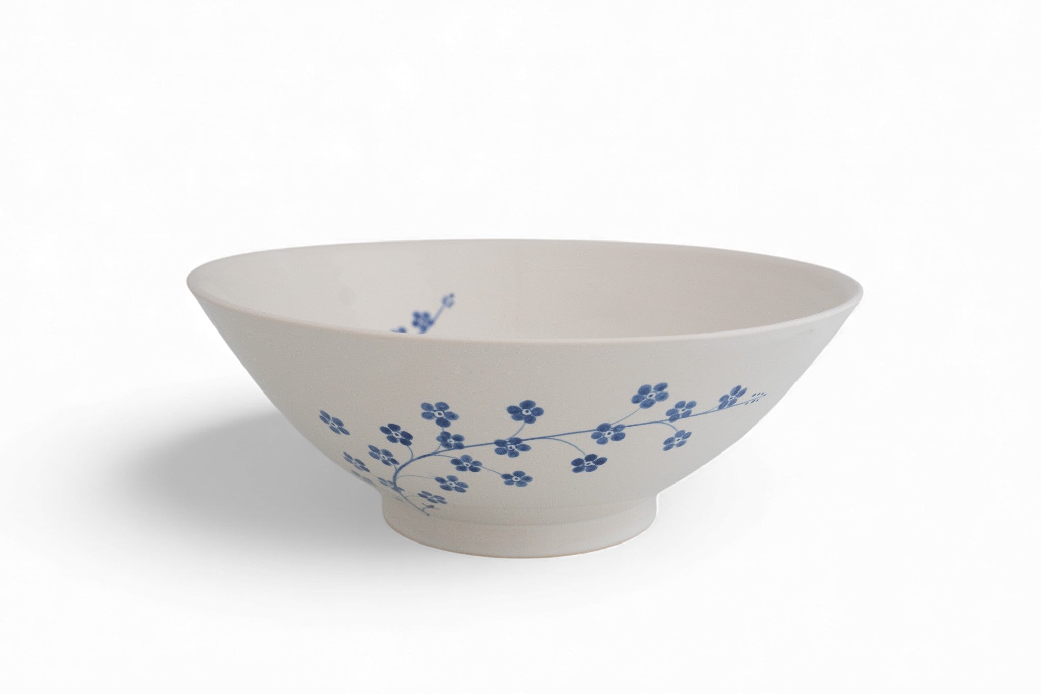 Handmade stoneware salad bowl with hand painted forget-me-not flowers