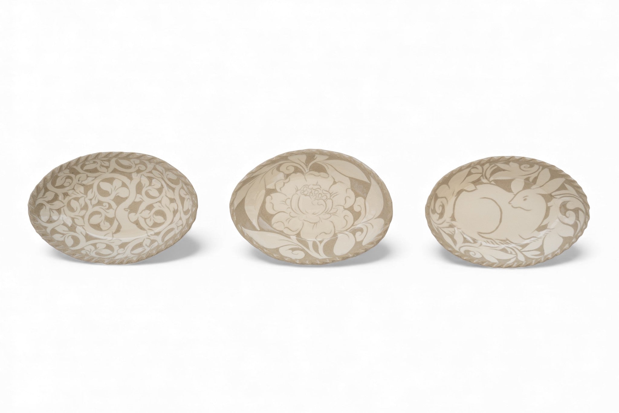 Handmade stoneware oval cream carved platters with tree pattern