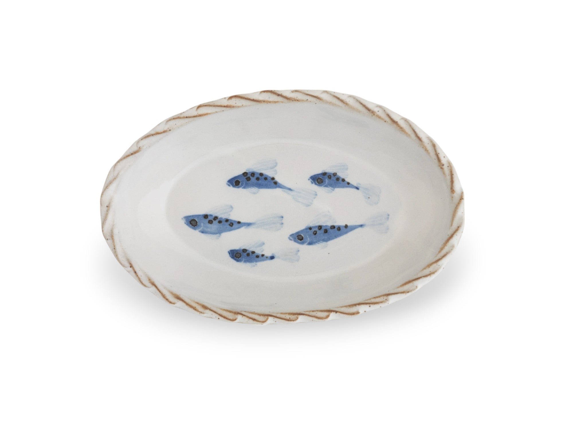 A small oval platter with a blue and white fish pattern and a decorative edge.
