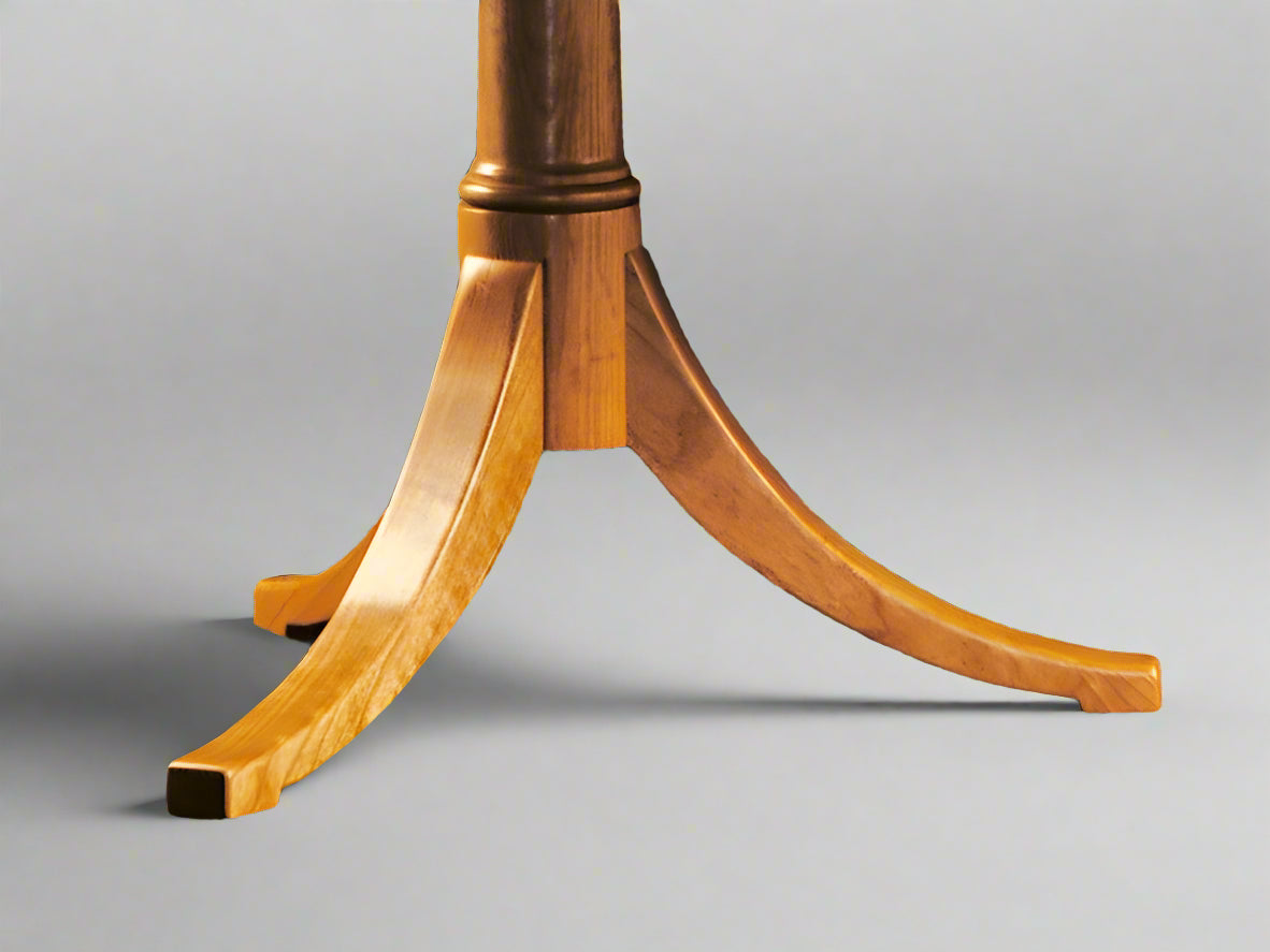 Vermont Handmade wooden extending pedestal dining table with hand-carved legs and a thumbnail edge on the top